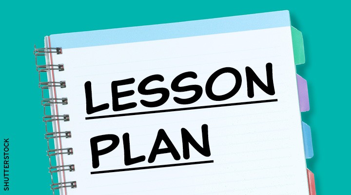 A spiral notebook with tabbed dividers displays the words Lesson Plan